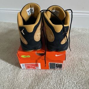 Brand is Jordans. Size 10.5. Color is Gold and Black